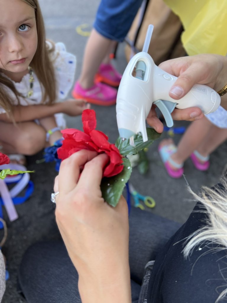 A child watching a hands-on craft activity at an SSA event.