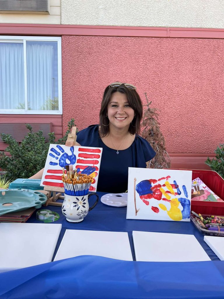 A woman presenting a hands-on activity at an SSA community event.