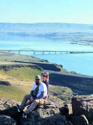 Two SSA community members on an outdoor overlook above the Columbia River.